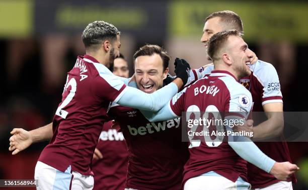 Mark Noble of West Ham United celebrates after scoring their sides third goal from the penalty spot with team mate Said Benrahma during the Premier...