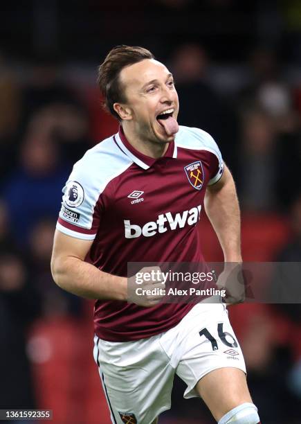 Mark Noble of West Ham United celebrates after he scores their sides third goal from the penalty spot during the Premier League match between Watford...