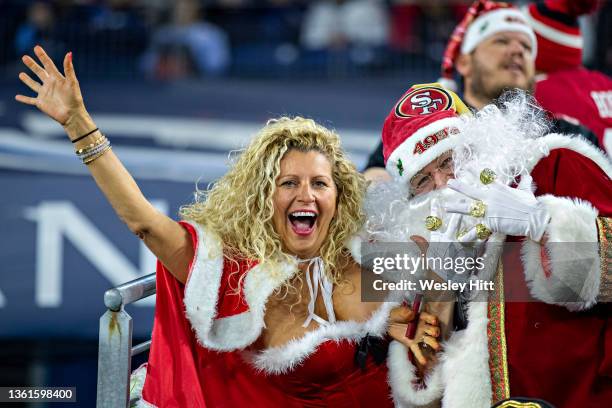 Fans of the San Francisco 49ers show their Christmas spirit before a game against the Tennessee Titans at Nissan Stadium on December 23, 2021 in...