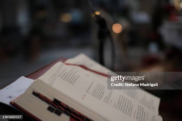 holy book in the church - roman god stock-fotos und bilder