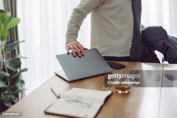 an anonymous businessman taking break of work - closing curtains stock pictures, royalty-free photos & images