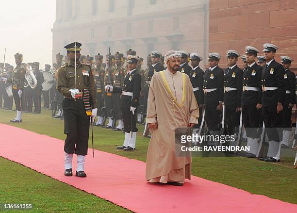The Minister of Defence Affairs of the Sultanate of Oman, Badar Bin Saud Bin Harib, reviews a guard of honour during a welcoming ceremony for the...