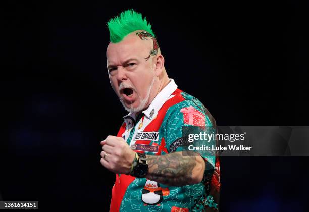 Peter Wright of Scotland reacts to the win during his Third Round Match against Damon Heta of Australia during Day Eleven of the William Hill World...