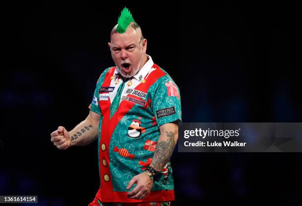 Peter Wright of Scotland reacts to the win during his Third Round Match against Damon Heta of Australia during Day Eleven of the William Hill World...