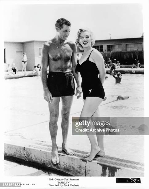 Cary Grant and Marilyn Monroe poolside in a scene from the film 'Monkey Business', 1952.
