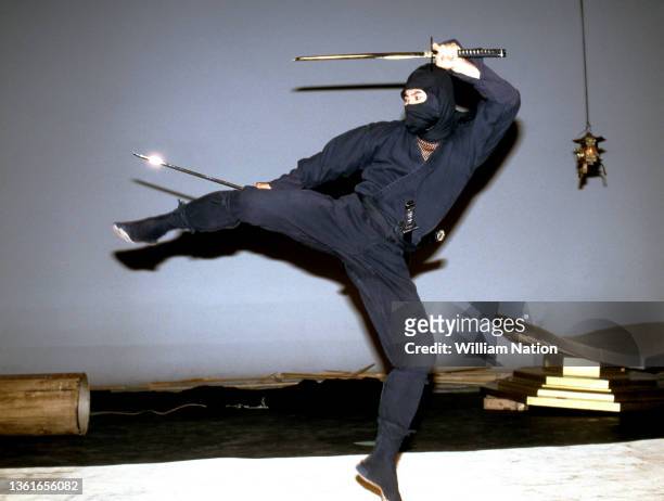 Japanese martial artist, actor, filmmaker and writer Sho Kosugi , poses for a portrait in a ninja outfit, on the set of "Pray for Death" circa 1985...