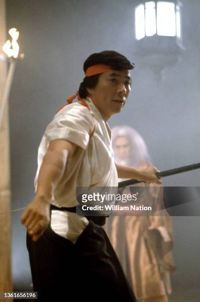 Japanese martial artist, actor, filmmaker and writer Sho Kosugi , trains with his father and sensei Robert Ito , on the set of "Pray for Death" circa...