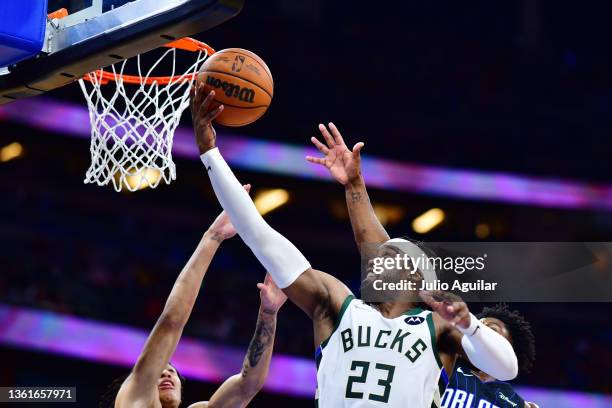 Wesley Matthews of the Milwaukee Bucks shoots a layup against the Orlando Magic in the fourth quarter at Amway Center on December 28, 2021 in...