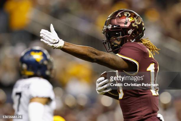 Wide receiver Dylan Wright of the Minnesota Golden Gophers reacts after a first-down reception against the West Virginia Mountaineers during the...