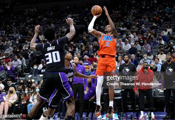 Shai Gilgeous-Alexander of the Oklahoma City Thunder shoots over Damian Jones of the Sacramento Kings during the third quarter at Golden 1 Center on...