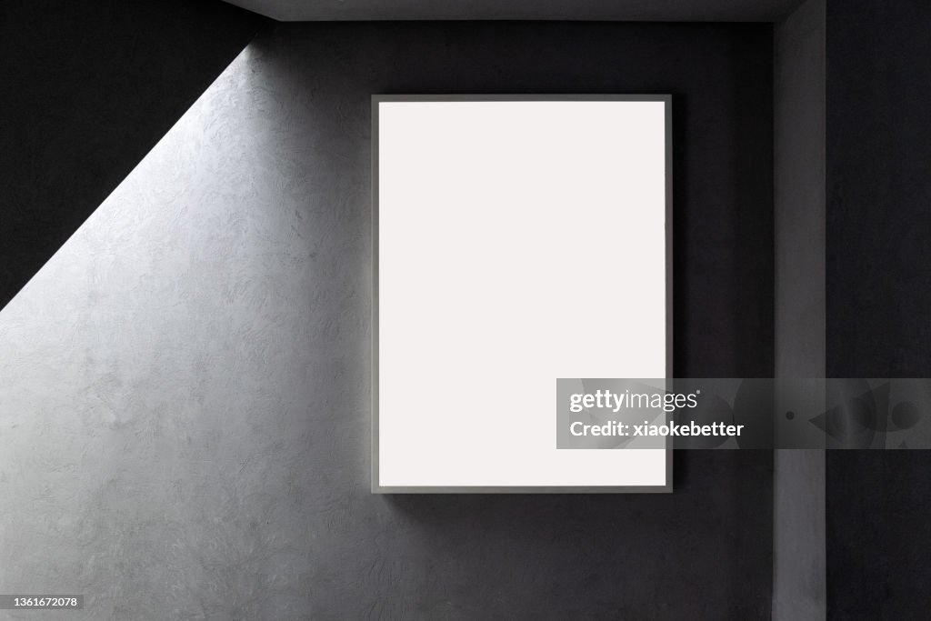 Front view of picture frame on concrete wall
