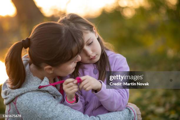 worries of childhood - sad mother stock pictures, royalty-free photos & images
