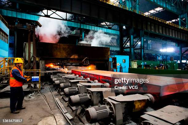 Worker operate on a steel production line at a factory of Jiujiang Pinggang Iron and Steel Co., Ltd. In the Hukou High-tech Industrial Park on...