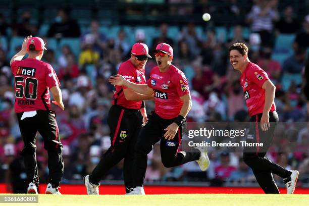 Sean Abbott of the Sixers celebrates catching out Chris Lynn of the Heat during the Men's Big Bash League match between the Sydney Sixers and the...