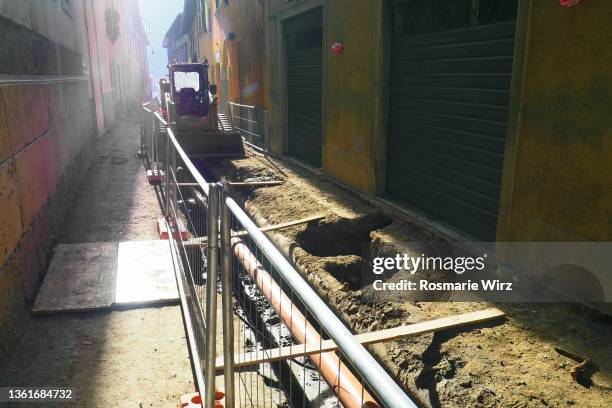 roadworks in old city center of italian town. - bulldozer house stock pictures, royalty-free photos & images