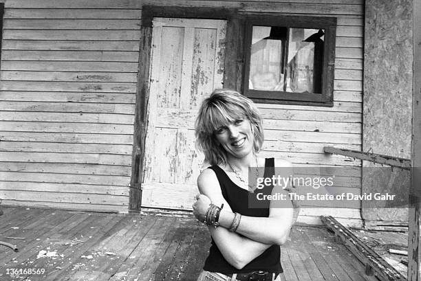 Country singer Lucinda Williams poses for a portrait in July 1990 in Lenox, Massachusetts.