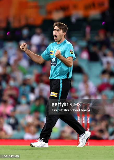 Xavier Bartlett of the Heat celebrates after claiming the wicket of Dan Christian of the Sixers during the Men's Big Bash League match between the...