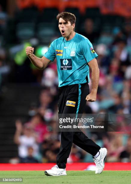 Xavier Bartlett of the Heat celebrates after claiming the wicket of Dan Christian of the Sixers during the Men's Big Bash League match between the...