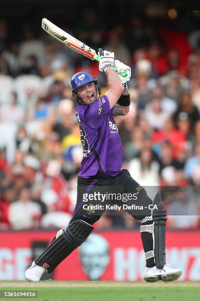 Ben McDermott of the Hurricanes scores a century while batting during the Men's Big Bash League match between the Melbourne Renegades and the Hobart...
