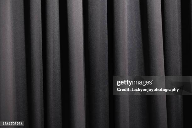 close up of velvet curtain, focus on folds and creases - black curtain stock pictures, royalty-free photos & images