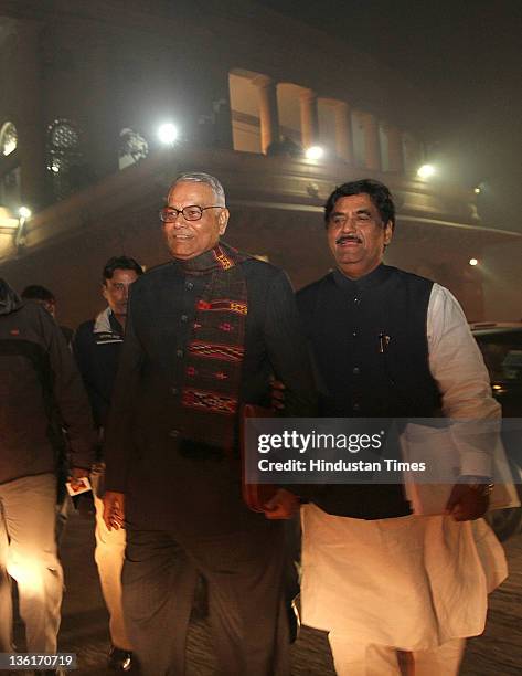 Leaders Yashwant Sinha and Gopinath Munde come out after the voting on Lokpal Bill in Lok Sabha at Parliament house on December 27, 2011 in New...