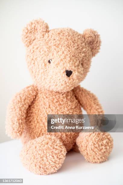 cute teddy bear sitting on a table, selective focus - stuffed toy stock pictures, royalty-free photos & images