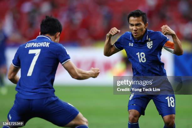 Chanathip Songkrasin of Thailand celebrates with Supachok Sarachat after scoring his second goal against Indonesia in the second half during the...