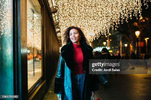 woman carrying shopping bags - barcelona shopping stock pictures, royalty-free photos & images