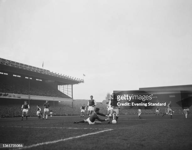British footballer Denis Law, British footballer Tony Burns, British footballer and Don Howe in action during the English Division 1 match between...
