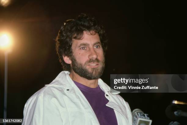 American actor and director Paul Michael Glaser speaking into an Entertainment Tonight microphone as he attends a press conference for the...