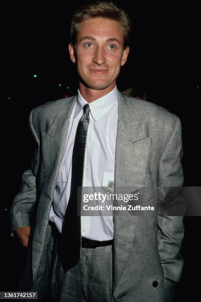 Canadian ice hockey player Wayne Gretzky, wearing a grey checked blazer with a dark grey tie, in Los Angeles, California, circa 1990.