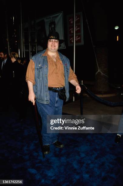 American singer, songwriter and musician John Popper, wearing a denim waistcoat, attends the Universal City premiere of 'Blues Brothers 2000', held...