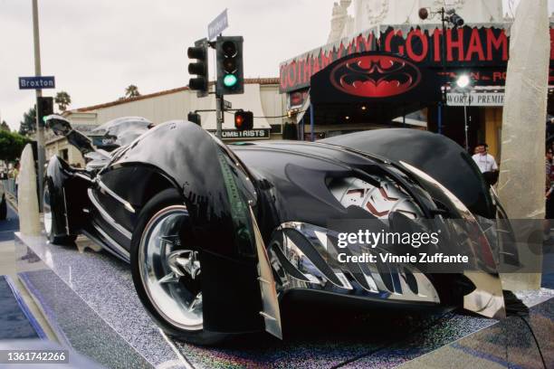 The Batmobile for 'Batman & Robin' on display outside Mann's Village and Bruin Theater ahead of the film's world premiere at the Fox Theater in the...