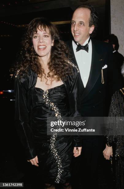 American actress and comedian Allyce Beasley, wearing a black outfit with gold detail, and her husband, American actor Vincent Schiavelli , wearing a...