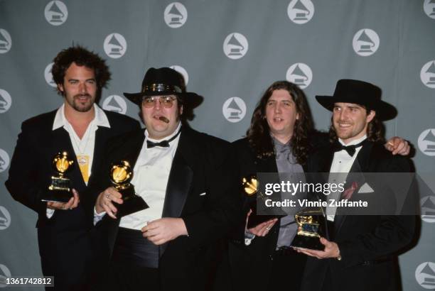 American rock band Blues Traveler in the press room of the 38th Annual Grammy Awards, held at the Shrine Auditorium in Los Angeles, California, 28th...