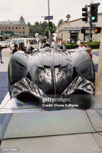 The Batmobile for 'Batman & Robin' on display outside Mann's Village and Bruin Theater ahead of the film's world premiere at the Fox Theater in the...