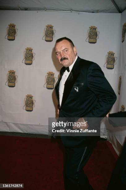 Former American Football player Dick Butkus, wearing a tuxedo and bow tie, attends the Sports Illustrated 20th Century Sports Awards, held at Madison...