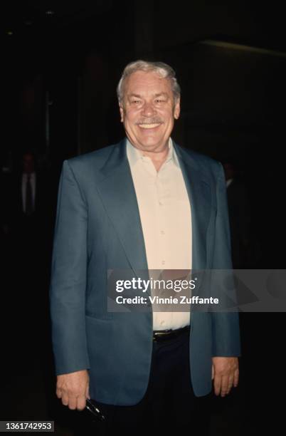 American businessman, philanthropist and investor Jerry Buss wearing a dark blue blazer over a white shirt, 1994. Buss is the majority owner of the...