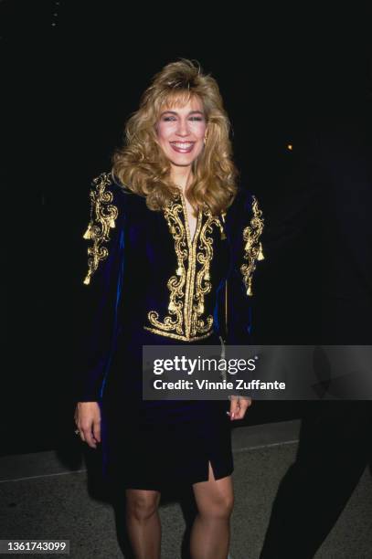 American talk show host Leeza Gibbons, wearing a blue velvet outfit with gold detail on the chest and shoulders, attends the 42nd Primetime Emmy...