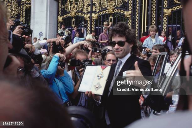 Irish singer-songwriter Bob Geldof after receiving the honorary Knight Commander of the Order of the British Empire honour, outside Buckingham Palace...