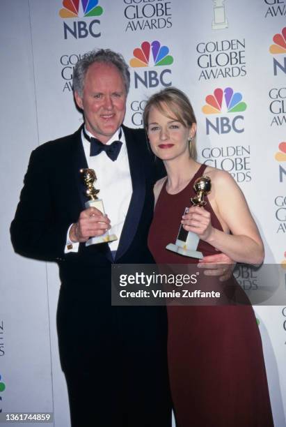 American actor John Lithgow and American actress Helen Hunt in the press room of the 54th Golden Globe Awards, held at the Beverly Hilton Hotel in...
