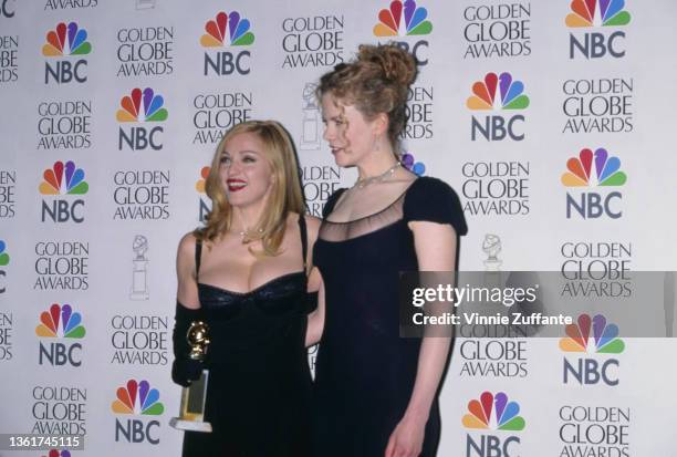 American singer-songwriter and actress Madonna and American-born Australian actress Nicole Kidman in the press room of the 54th Golden Globe Awards,...