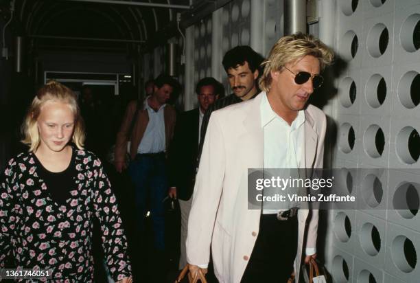 Kimberly Stewart and her father, British singer and songwriter Rod Stewart at Los Angeles International Airport in Los Angeles, California, circa...