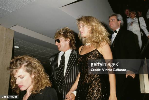 New Zealand model Rachel Hunter and her husband, British singer and songwriter Rod Stewart attend the Fashion Institute Gala held at the Century...