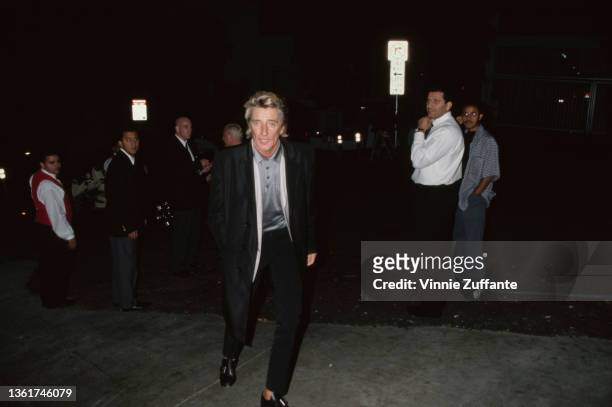 British singer and songwriter Rod Stewart approaches the photographer as he attends the PETA Party of the Century and Humanitarian Awards, held at...