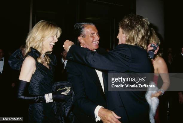 American actress and model Alana Hamilton, her husband, American actor George Hamilton, British singer and songwriter Rod Stewart, and his wife New...