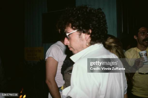 American singer-songwriter Bob Dylan backstage at the Live Aid benefit concert, held at the John F Kennedy Stadium in Philadelphia, Pennsylvania,...