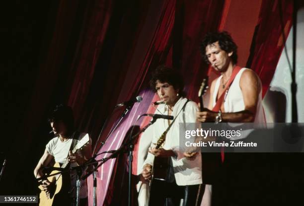 British musician and songwriter Ronnie Wood, American singer-songwriter Bob Dylan, and British guitarist and songwriter Keith Richards perform at the...