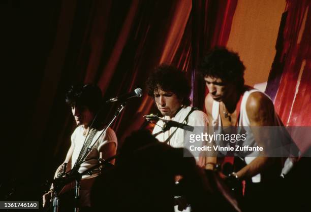 British musician and songwriter Ronnie Wood, American singer-songwriter Bob Dylan, and British guitarist and songwriter Keith Richards perform at the...