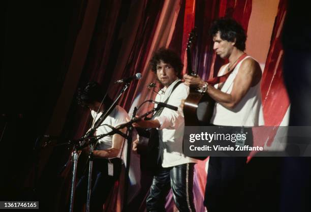 British musician and songwriter Ronnie Wood, American singer-songwriter Bob Dylan, and British guitarist and songwriter Keith Richards perform at the...